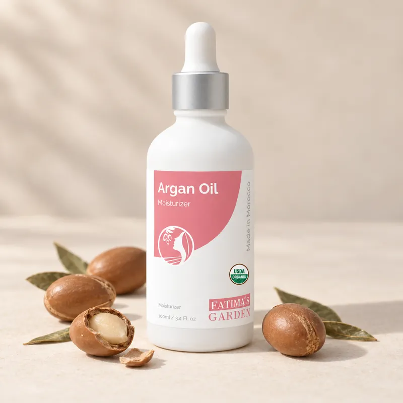 The Fatima's Garden argan oil bottle, 100 ml, beside whole and cracked argan nuts
