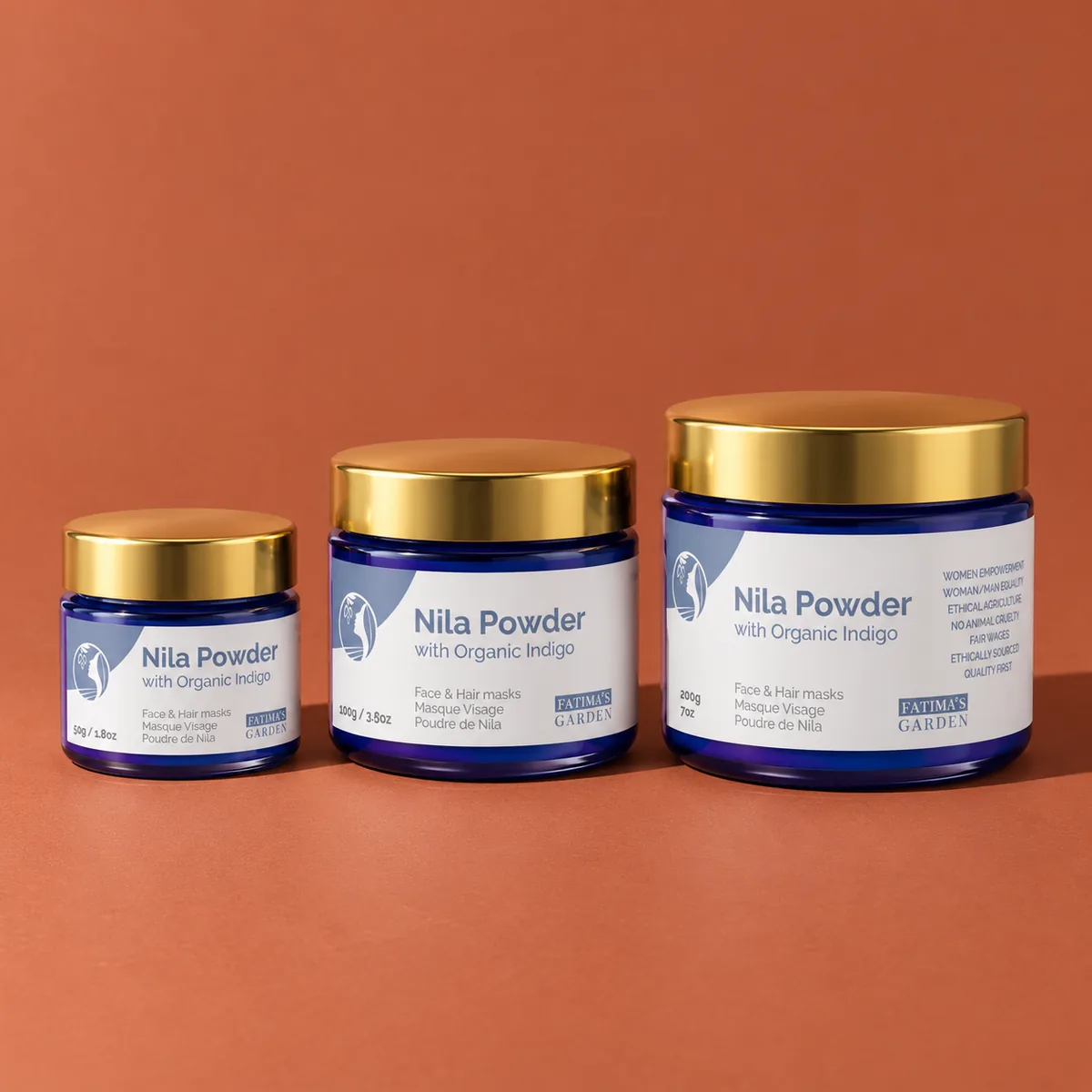The three sizes of Fatima’s Garden nila powder, on a terracotta background